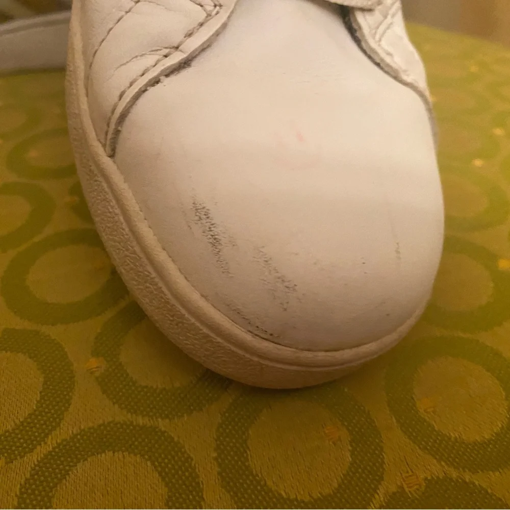 Adidas White and gold sneakers.